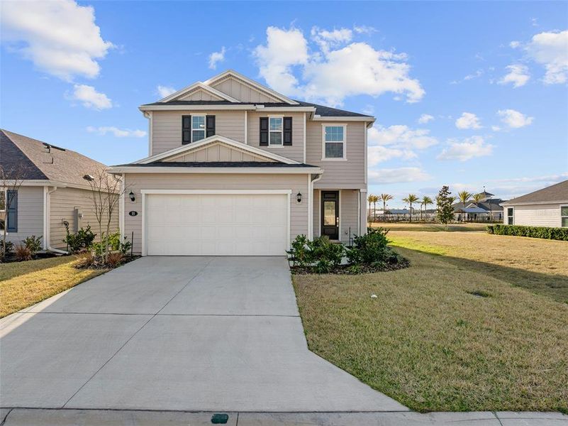 Front exterior of a new home in Somerset - Classic Series, Palm Coast, FL, highlighting curb appeal (Image 2).