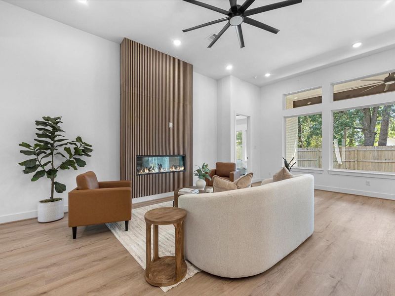 Anchored by a modern, floor to ceiling decorative fireplace Anchored by a modern, floor to ceiling decorative fireplace