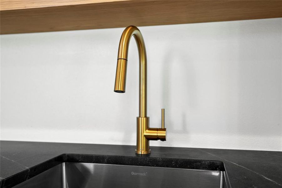 Kitchen view of dark countertops