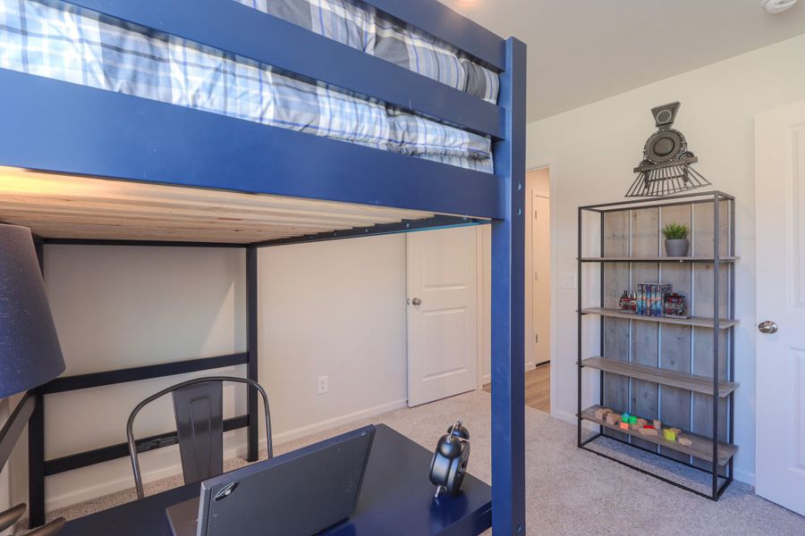 A room with a bed and shelves. A room with a bed and shelves.