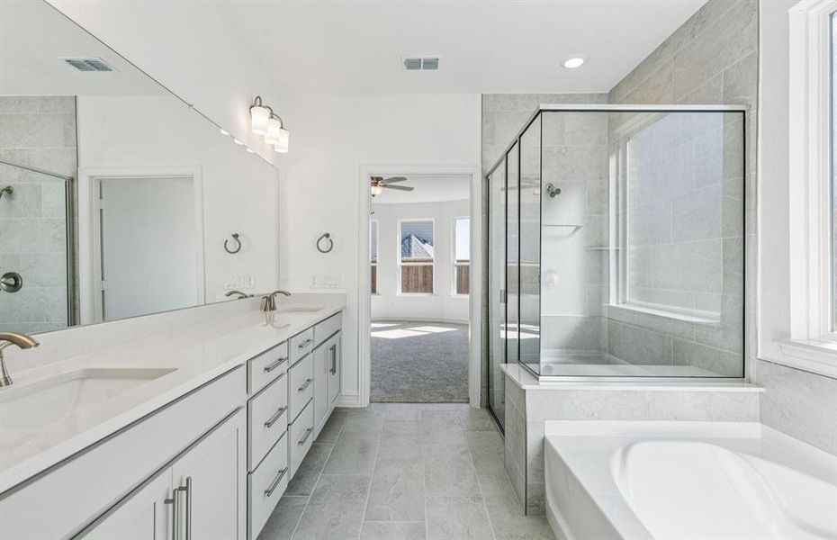 Owner's private bath with full shower & tub combo Owner's private bath with full shower & tub combo