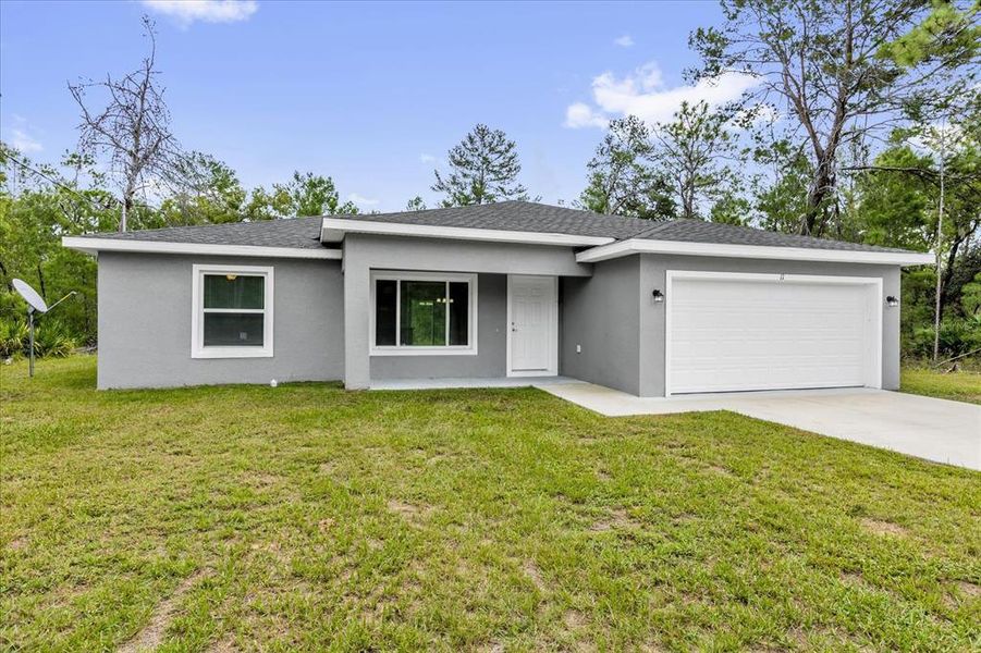 Front exterior of a new home in , Ocklawaha, FL, highlighting curb appeal (Image 19). Front exterior of a new home in , Ocklawaha, FL, highlighting curb appeal (Image 19).