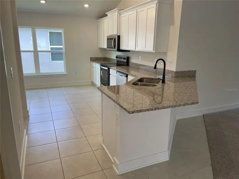 Furnished interior view inside a new home in Harmony Central, St. Cloud (Image 4).