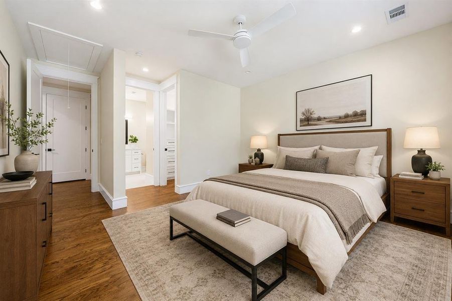 Well-appointed bedroom featuring wood-finish flooring, a contemporary ceiling fan, recessed lighting, and a neutral color palette