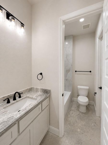 Secondary bedroom with their own sink.