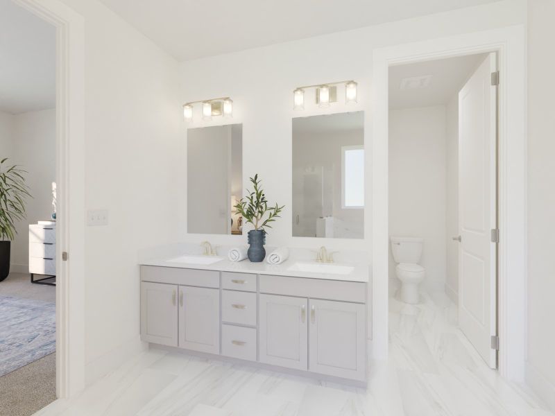 The primary bathroom offers dual vanity sinks and a walk-in shower.