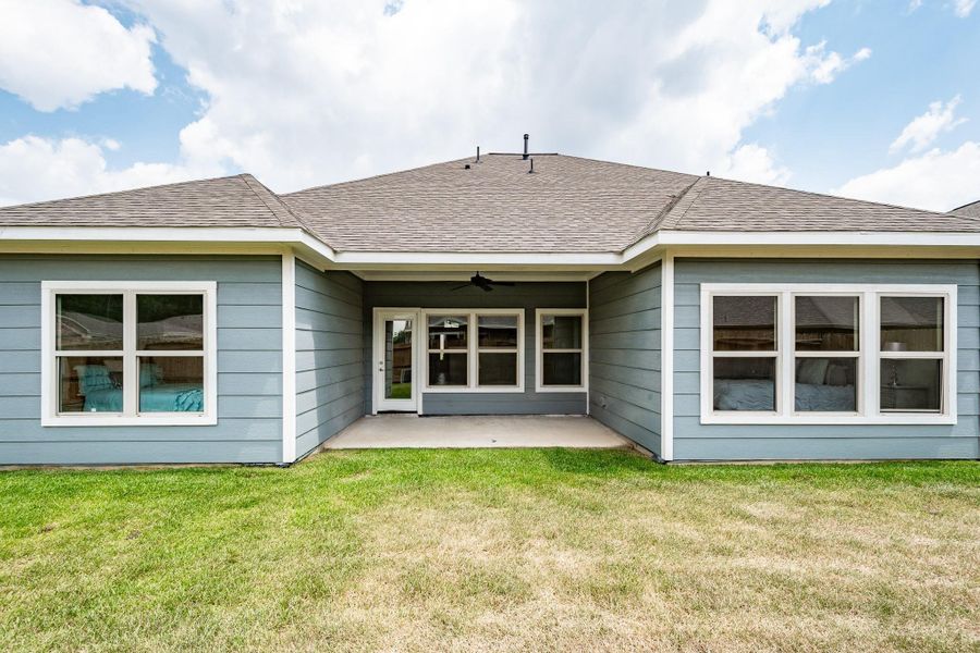 Covered patio overlooking expansive backyard. Covered patio overlooking expansive backyard.