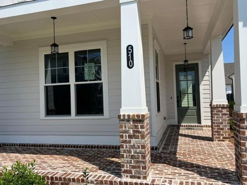 Exterior details and patio area of a home in Promenade at Sawnee Village, Cumming (Image 3).