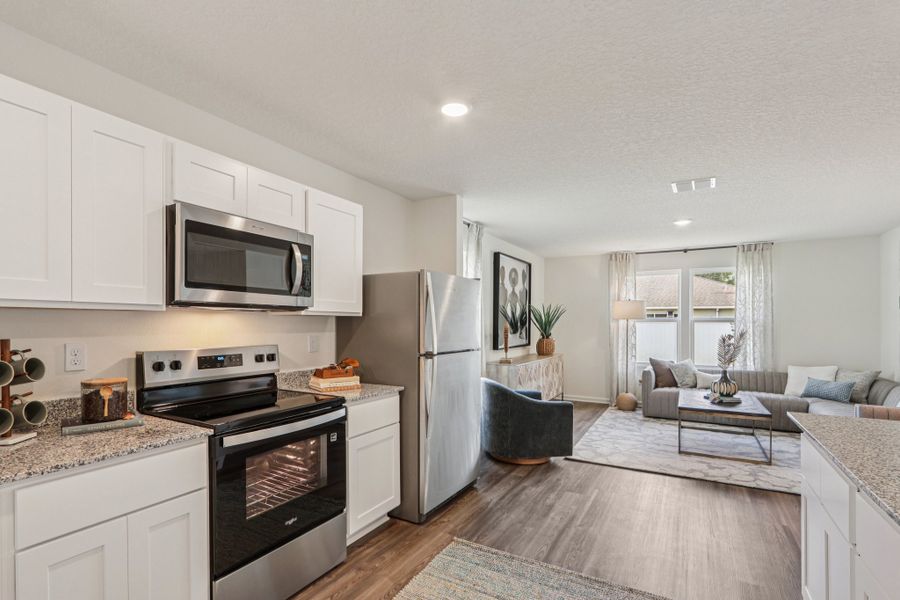 A kitchen with white cabinets. A kitchen with white cabinets.