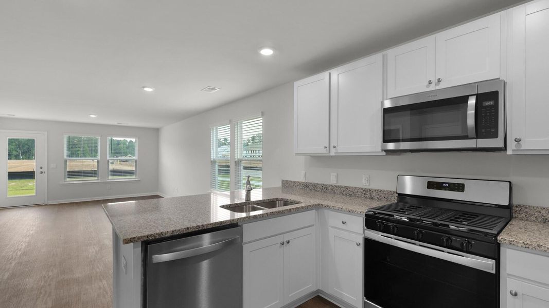 Furnished interior view inside a new home in Pine Hills Townhomes at Cane Bay, Summerville (Image 3).