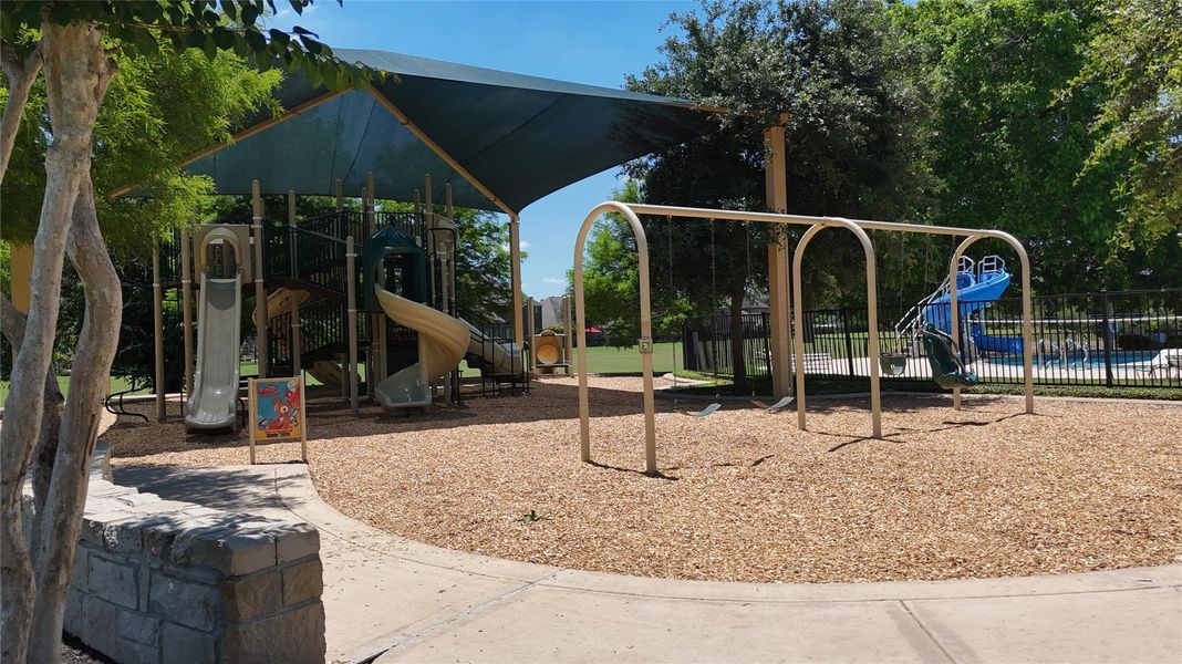 The community features a playground, providing a fun and convenient space for outdoor recreation and family enjoyment.