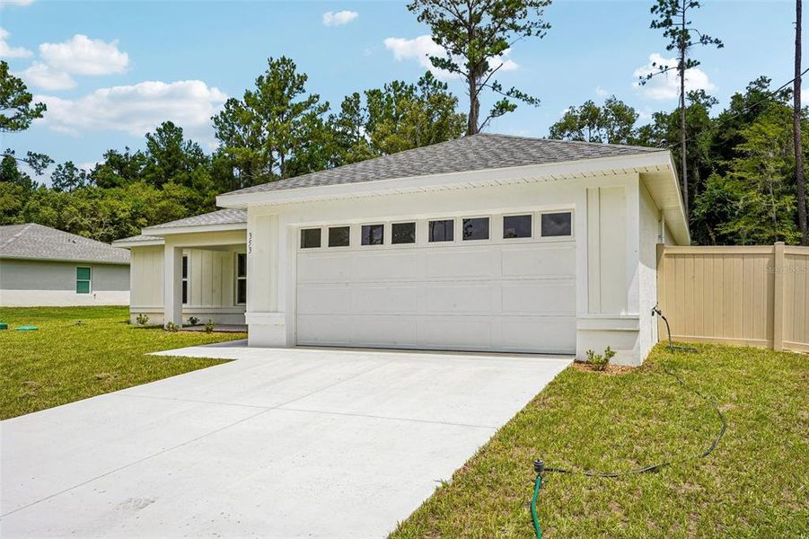 Front exterior of a new home in , Citrus Springs, FL, highlighting curb appeal (Image 2). Front exterior of a new home in , Citrus Springs, FL, highlighting curb appeal (Image 2).