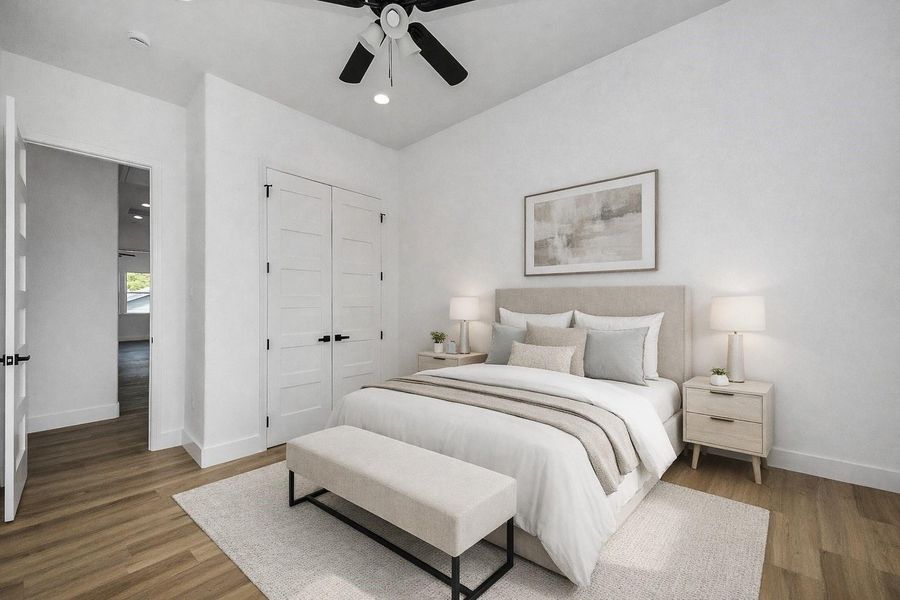 Bright and inviting guest bedroom featuring modern finishes, abundant natural light, and a clean, neutral design. A comfortable and versatile space perfect for hosting guests or creating a cozy retreat.