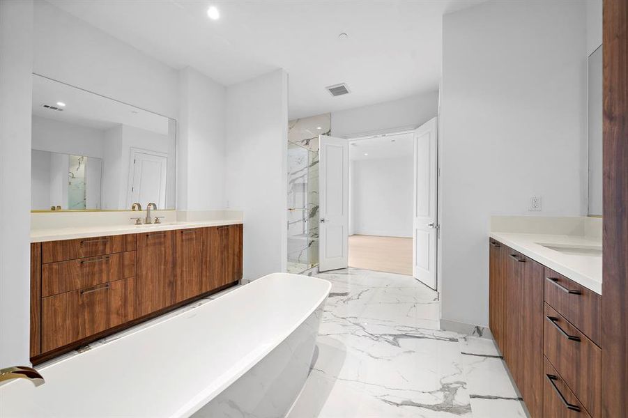 Primary bath, light filled and spacious with elegant design touches throughout.