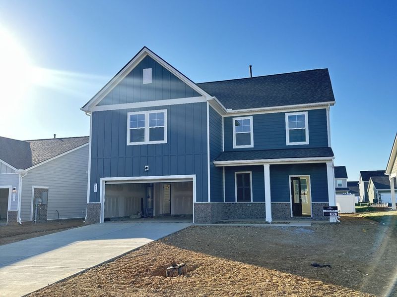 Front exterior of a new home in Sage Farms, White House, TN, highlighting curb appeal (Image 2).