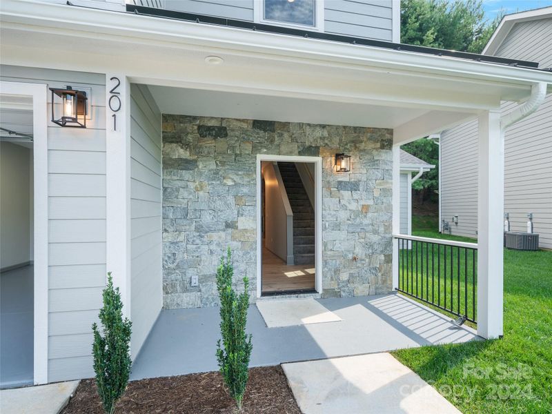 Front porch covered entrance to townhome Front porch covered entrance to townhome