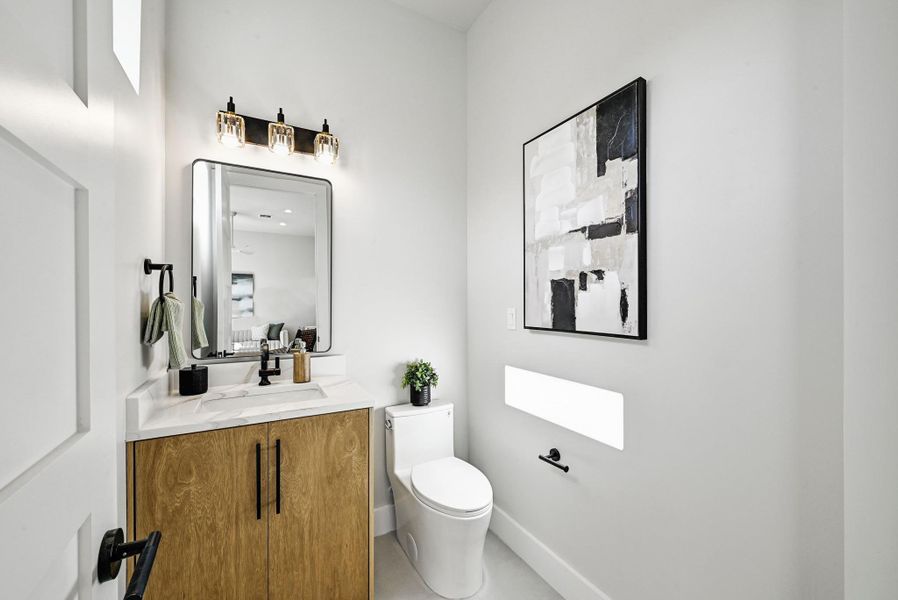 2nd Floor Half Bath (This is Unit #2 - each Unit has the same layout, however a few differing details such as light fixtures, custom cabinet/backsplash/tile colors)