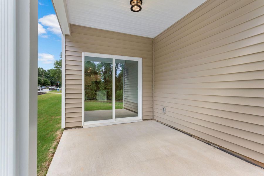 Exterior details and patio area of a home in East Main Townes, Spartanburg (Image 4). Exterior details and patio area of a home in East Main Townes, Spartanburg (Image 4).