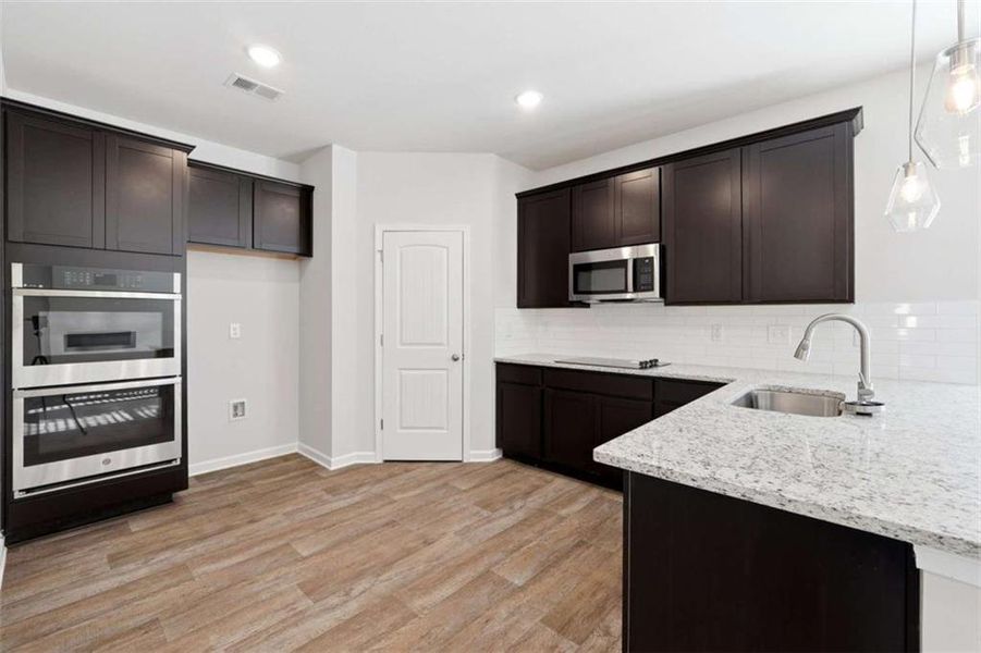 Furnished interior view inside a new home in , Perry (Image 5). Furnished interior view inside a new home in , Perry (Image 5).