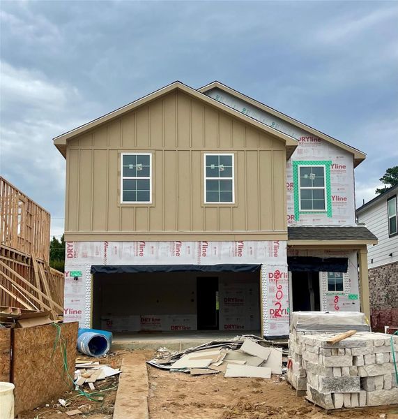 Front exterior of a new home in Lakes at Black Oak, Magnolia, TX, highlighting curb appeal (Image 14).