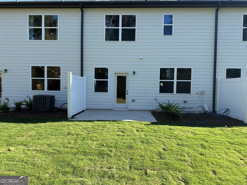 Exterior details and patio area of a home in Millstone at Mundy Mill, Gainesville (Image 2). Exterior details and patio area of a home in Millstone at Mundy Mill, Gainesville (Image 2).
