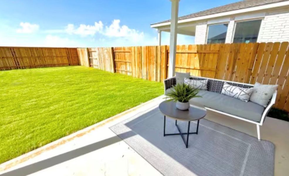 Exterior details and patio area of a home in Sage Collection – Freedom at Anthem, Kyle (Image 1).