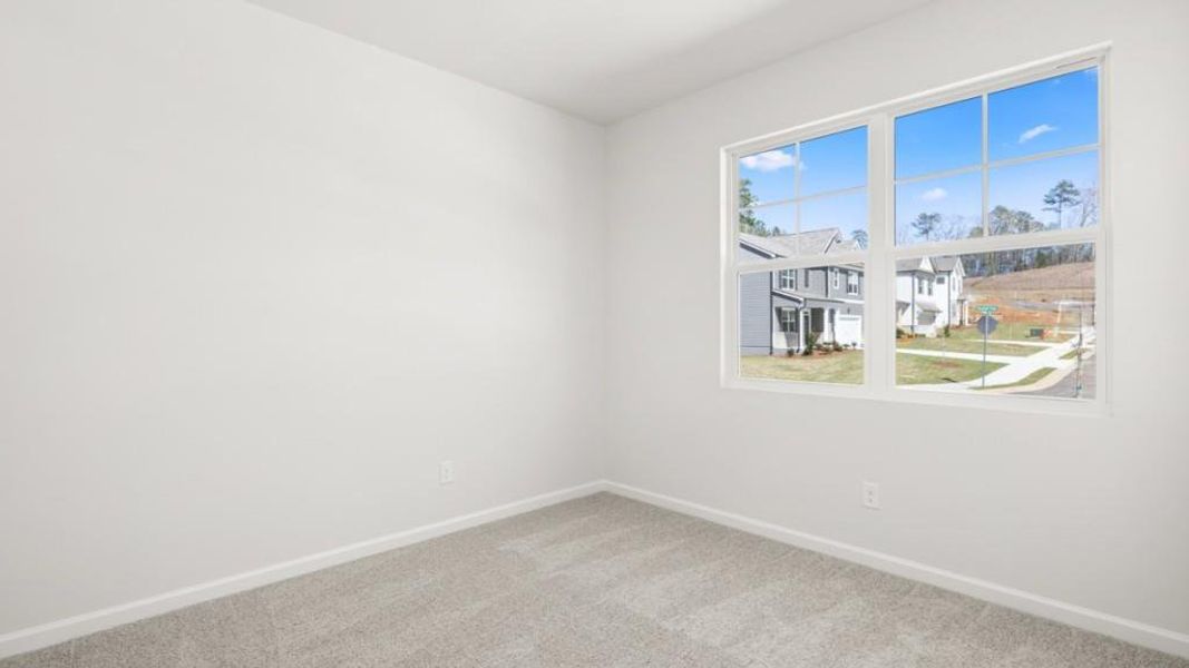 Spacious, unfurnished interior of a new home in South Wind, Fairburn (Image 27).