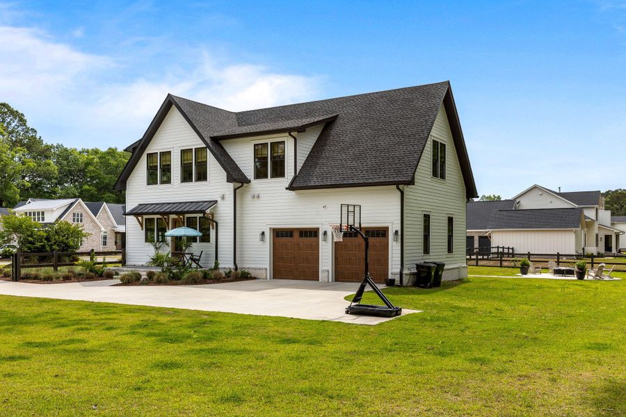 Front exterior of a new home in , Johns Island, SC, highlighting curb appeal (Image 22). Front exterior of a new home in , Johns Island, SC, highlighting curb appeal (Image 22).