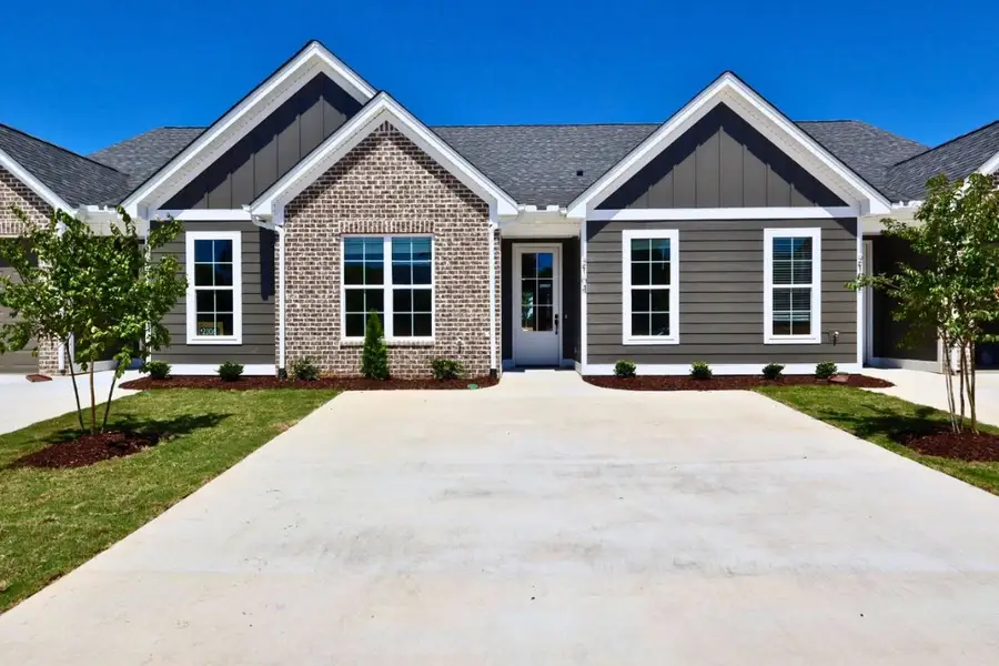 Front exterior of a new home in The Hoback, Cleveland, TN, highlighting curb appeal (Image 2). Front exterior of a new home in The Hoback, Cleveland, TN, highlighting curb appeal (Image 2).
