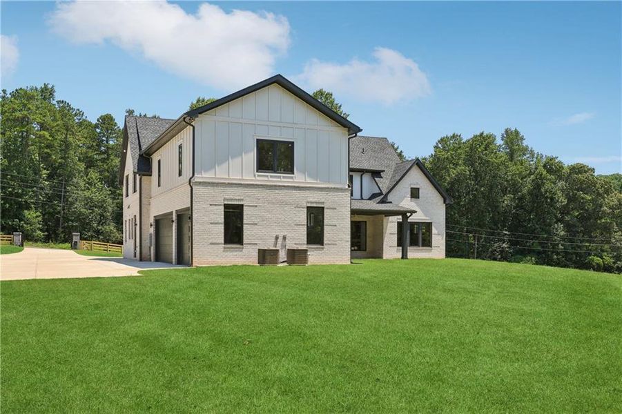 Front exterior of a new home in , Braselton, GA, highlighting curb appeal (Image 32).