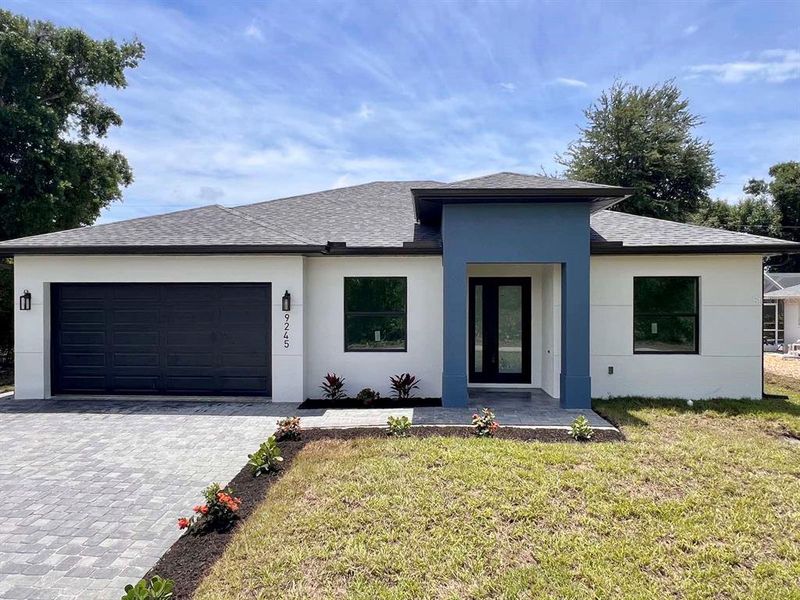 Front exterior of a new home in , Englewood, FL, highlighting curb appeal (Image 1). Front exterior of a new home in , Englewood, FL, highlighting curb appeal (Image 1).