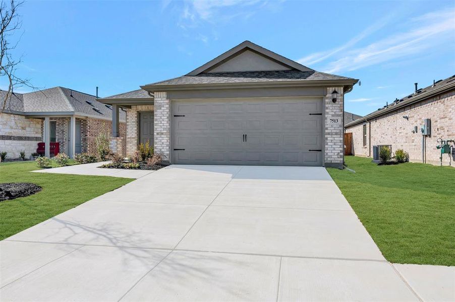 Front exterior of a new home in Mobberly Farms, Pilot Point, TX, highlighting curb appeal (Image 24).