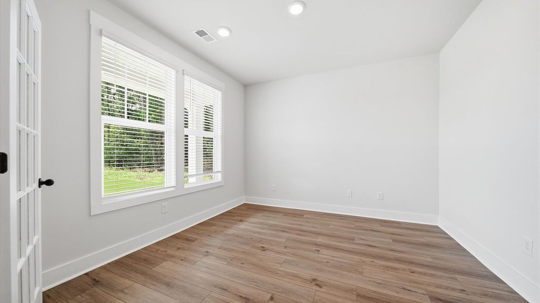 First-class home office behind elegant French doors—designed with high standards in mind
