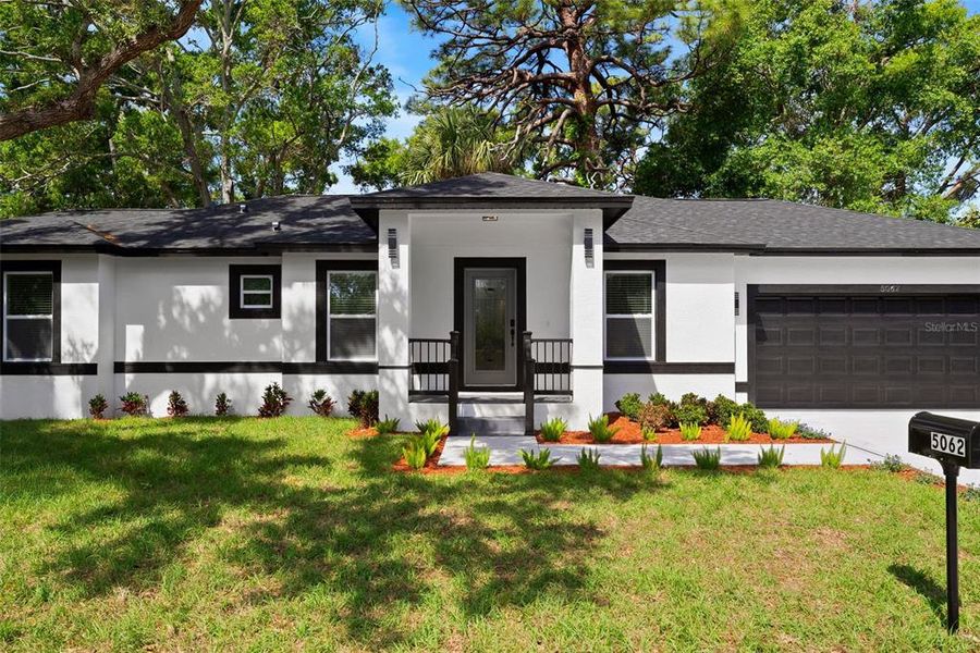 Front exterior of a new home in , St. Petersburg, FL, highlighting curb appeal (Image 23).