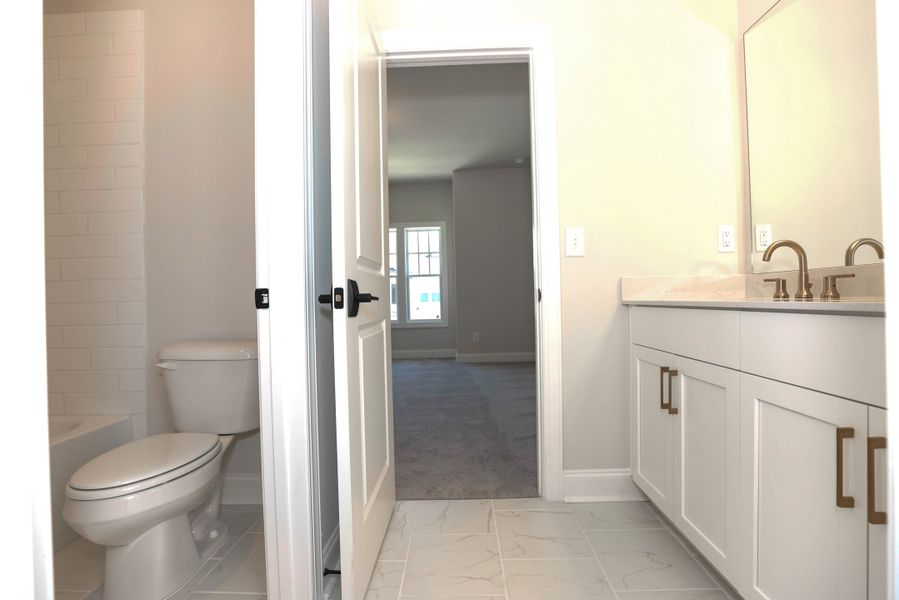 Representative furnished interior of a home built from the The Maddox by The Providence Group in Bellmoore Park, Johns Creek (Image 16).