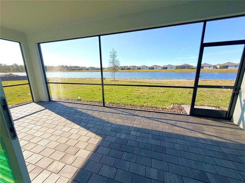 Exterior details and patio area of a home in Island Lakes at Coco Bay, Englewood (Image 3).