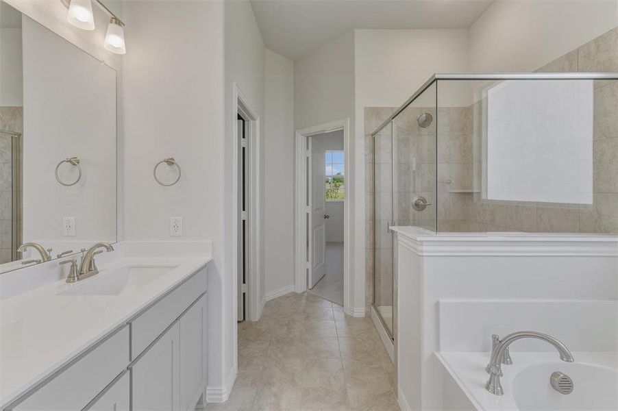 Dual vanity with white cabinetry, integrated sinks, and brushed nickel fixtures