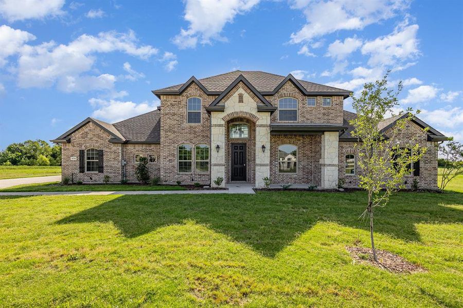 Front exterior of a new home in , Waxahachie, TX, highlighting curb appeal (Image 17).