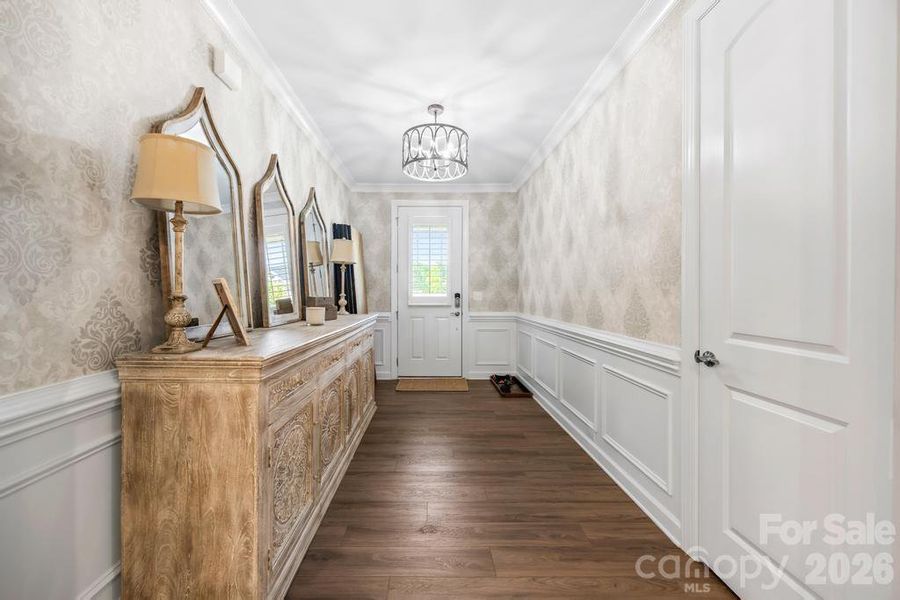 Designer wall coverings added by sellers in foyer