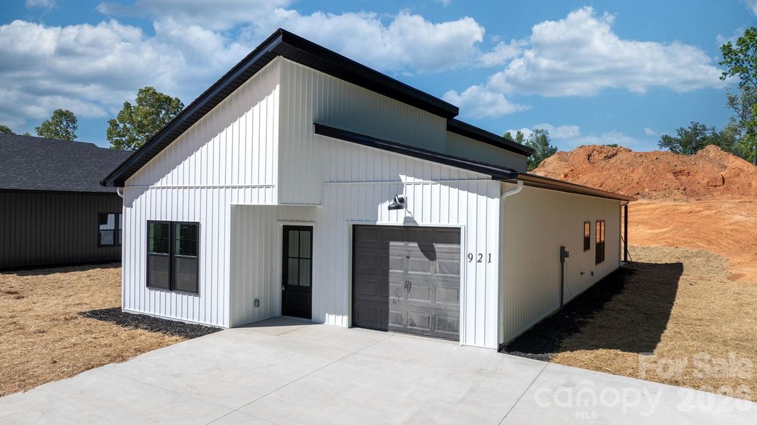 Front exterior of a new home in , Lenoir, NC, highlighting curb appeal (Image 16).
