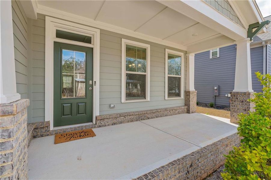Exterior details and patio area of a home in Tributary Village, Douglasville (Image 26).