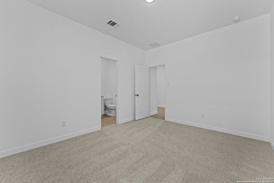 Spacious, unfurnished interior of a new home in Waterwheel: Coastline Collection, San Antonio (Image 21).