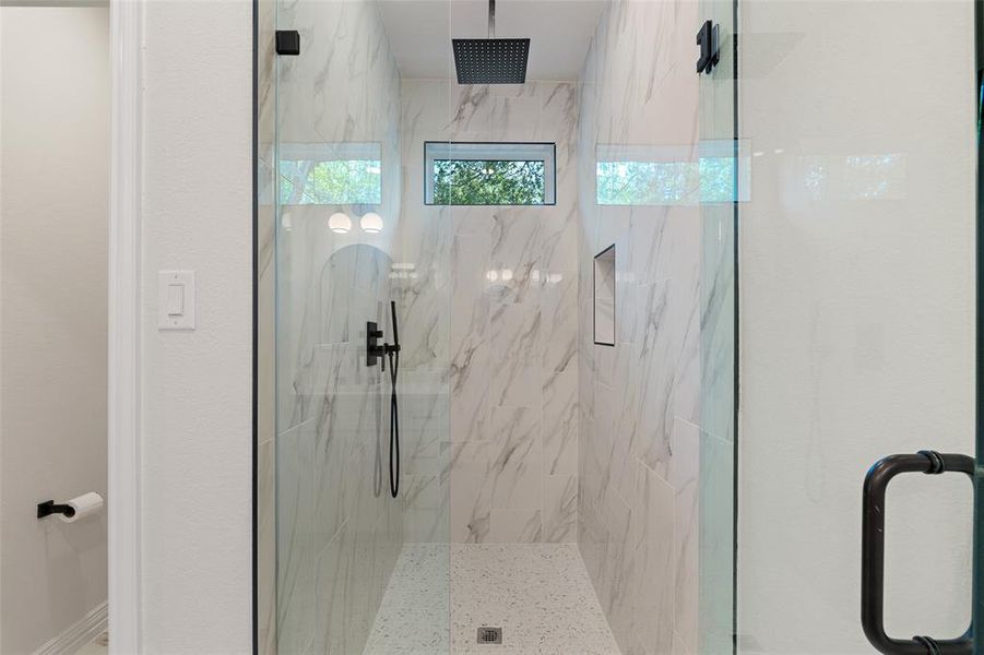 Bathroom with a shower with door