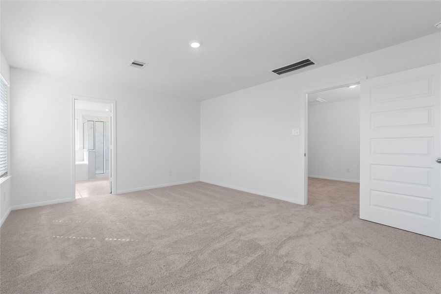 Additional view from primary bedroom looking out to the Loft and the primary bathroom.