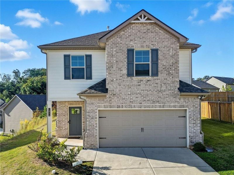 Front exterior of a home in the Camp Creek Village community, located in Atlanta, GA (Image 11). Front exterior of a home in the Camp Creek Village community, located in Atlanta, GA (Image 11).