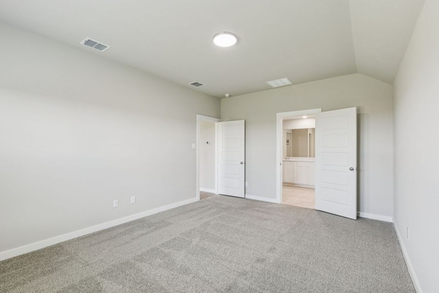 Primary Suite in the Harper home plan by Trophy Signature Homes – REPRESENTATIVE PHOTO