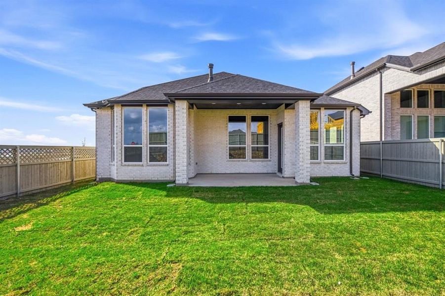 Exterior details and patio area of a home in Pecan Square, Northlake (Image 18).