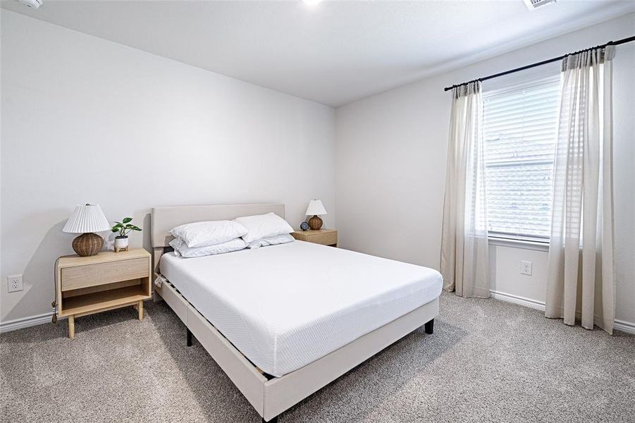 Bedroom featuring carpet flooring