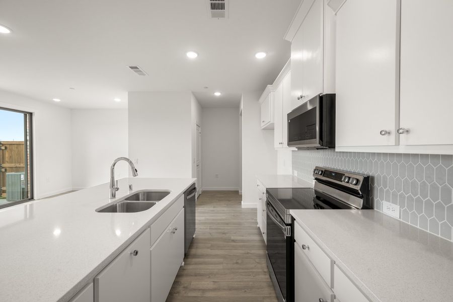 Furnished interior view inside a new home in Wildridge, Oak Point (Image 8).