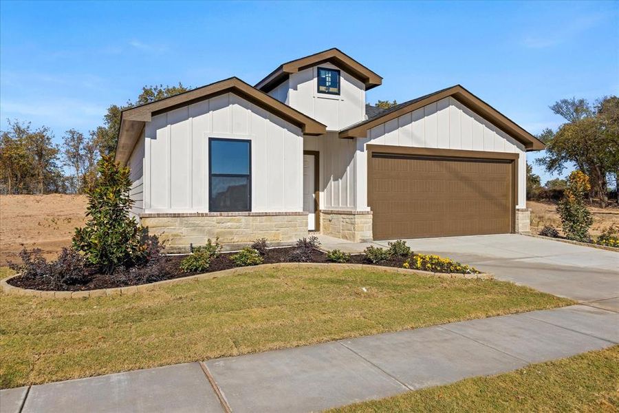 Front exterior of a new home in , Tolar, TX, highlighting curb appeal (Image 2). Front exterior of a new home in , Tolar, TX, highlighting curb appeal (Image 2).